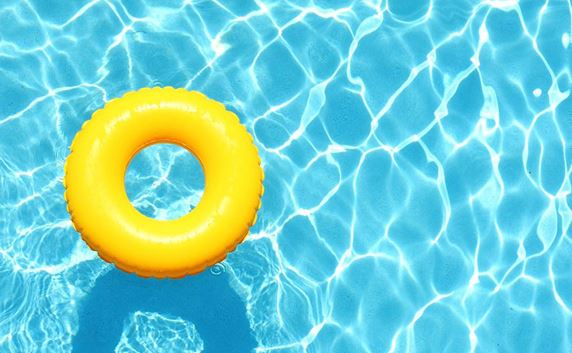 Yellow raft floating in pool