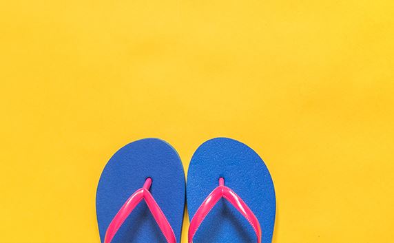 yellow background with blue and pink flip flops