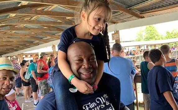 HCPD officer with child outside 