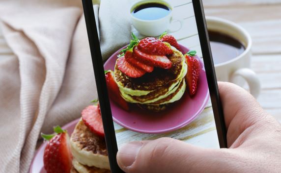 cell phone taking a picture of food