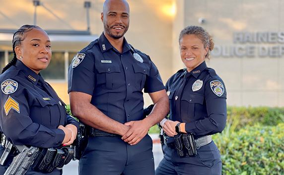 three police officers standing outside