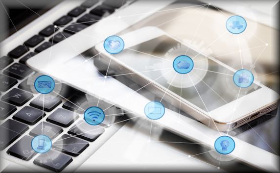 Stacked phone, tablet, and laptop keyboard