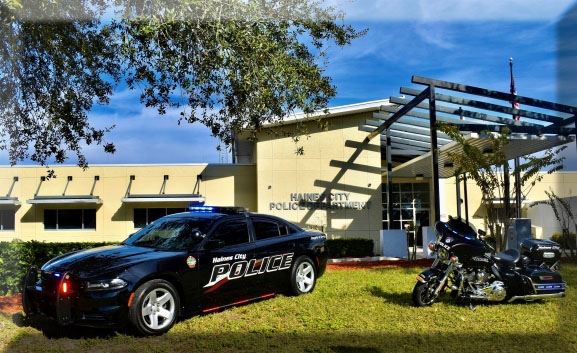 Public safety vehicles parked in front of Haines City police department