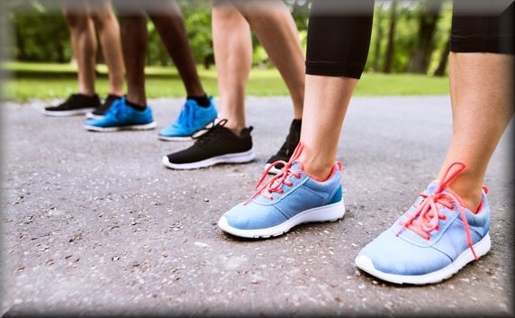 4 sets of feet ready to start a race