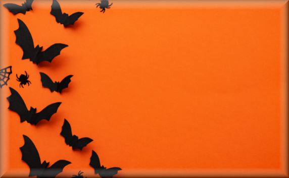 Bats flying on an orange background