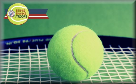 Tennis ball resting on a racket