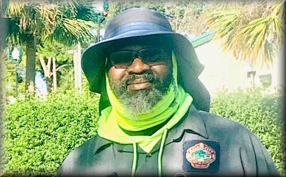 Man wearing a hat with neck flap