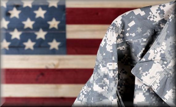 Soldier's shoulder in fatigues in front of an American flag painting