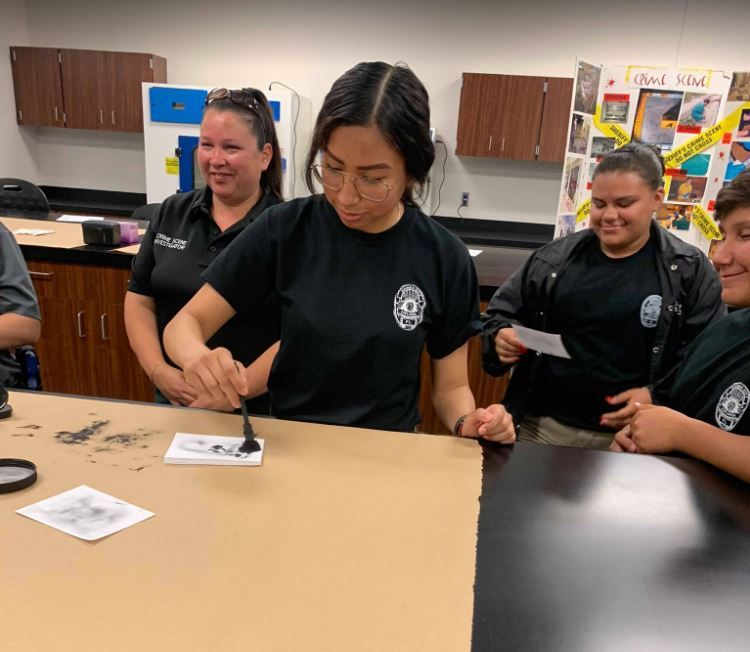 Explorer Nancy Mendoza works on crime scene processing during the Polk County Sheriff’s Office