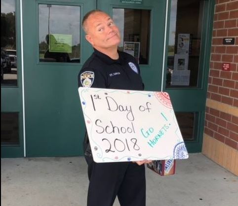 Officer James Garrison shows off his school spirit on the first day of school at Haines City High Sc