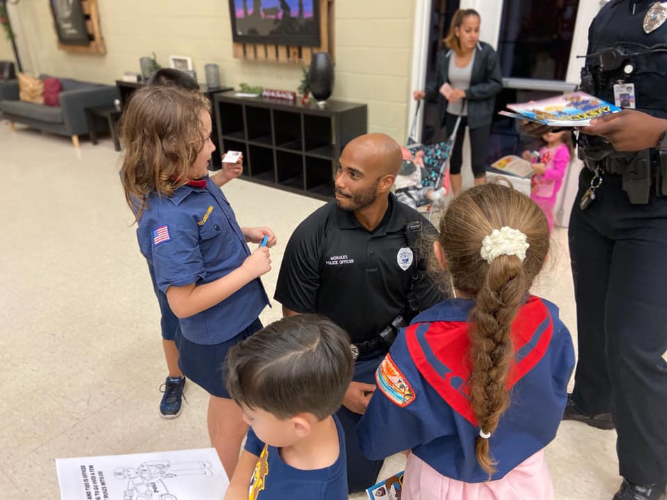 Officer Joel Morales talks with a group of Cub Scouts at First Presbyterian Church on Dec. 16, 2019.